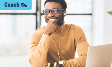 Man smiling with computer