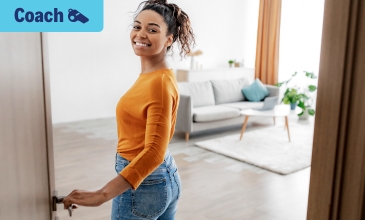 Woman opening door to home